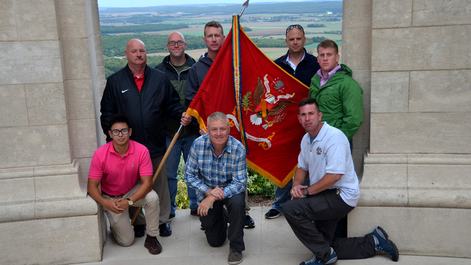 While en route to a ceremony commemorating the 1918 Meuse-Argonne offensive in northeastern France, NC State Army Reserve members stopped at the Montsec American Monument in France, which honors the 1918 Battle of Saint-Mihiel in which their unit fought during WWI. They are holding their 113th Field Artillery Regiment flag.