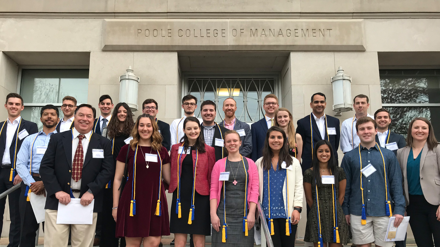 Poole College's 2019 Beta Gamma Sigma inductees who were able to attend the ceremony, gather for photo at the college's front stairs.