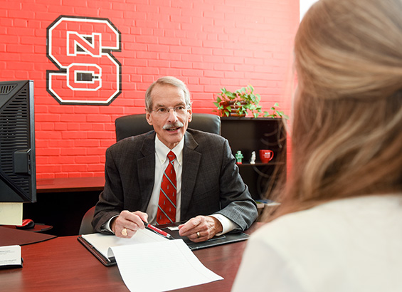 Scott Showalter, professor and MAC program director, talking with a MAC student