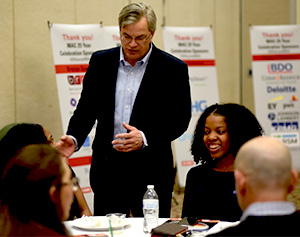 Professor Don Pagach, speaking with students at the summit.