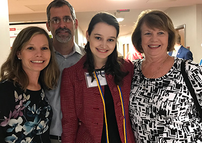 Hanna Lawrence with guests at the Beta Gamma Sigma reception.