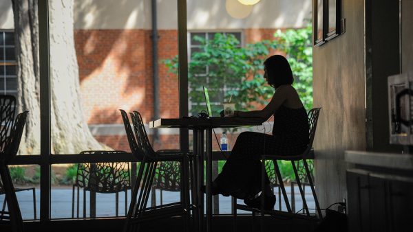 A student completing work at NC State public work spaces