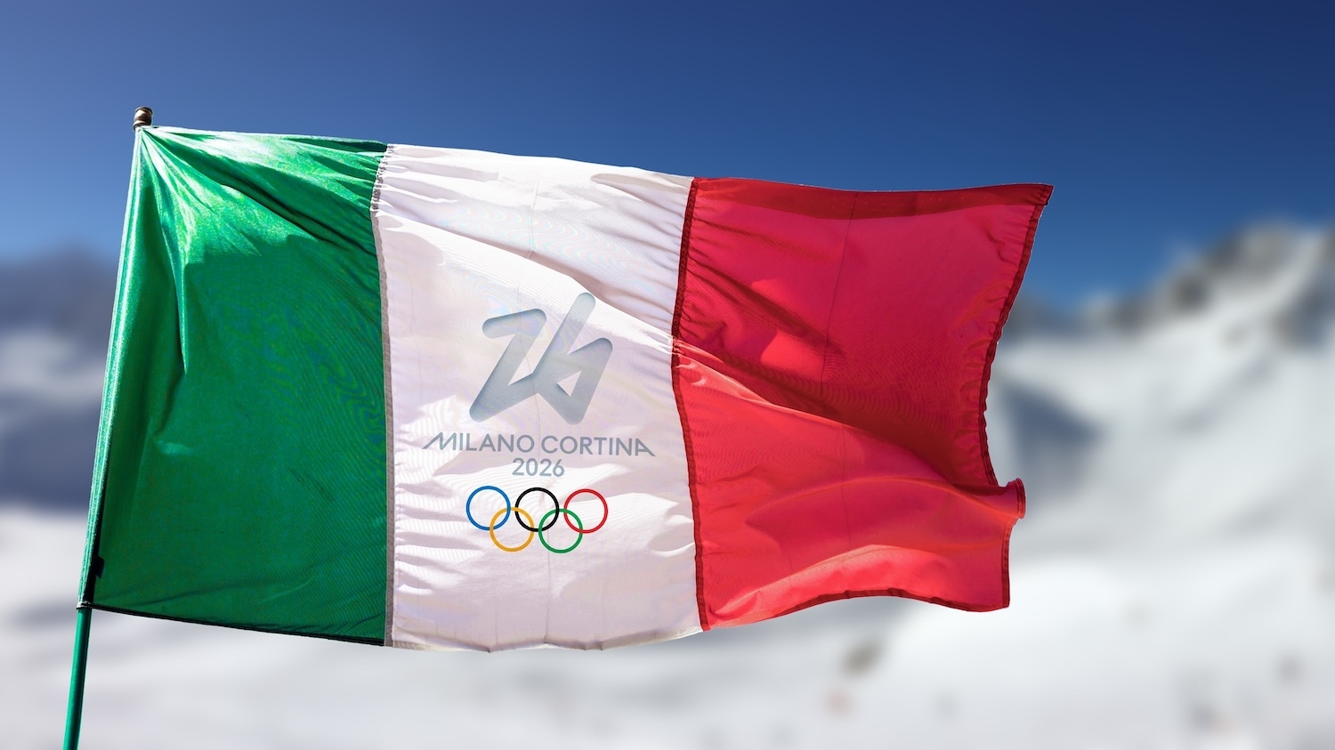 Italian flag with 2026 Winter Olympics logo waving in front of snowy mountains